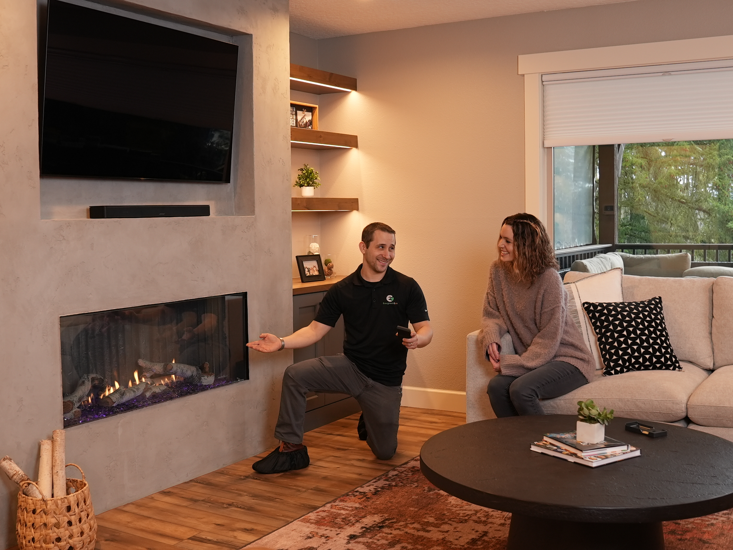 Technician showing a working fireplace