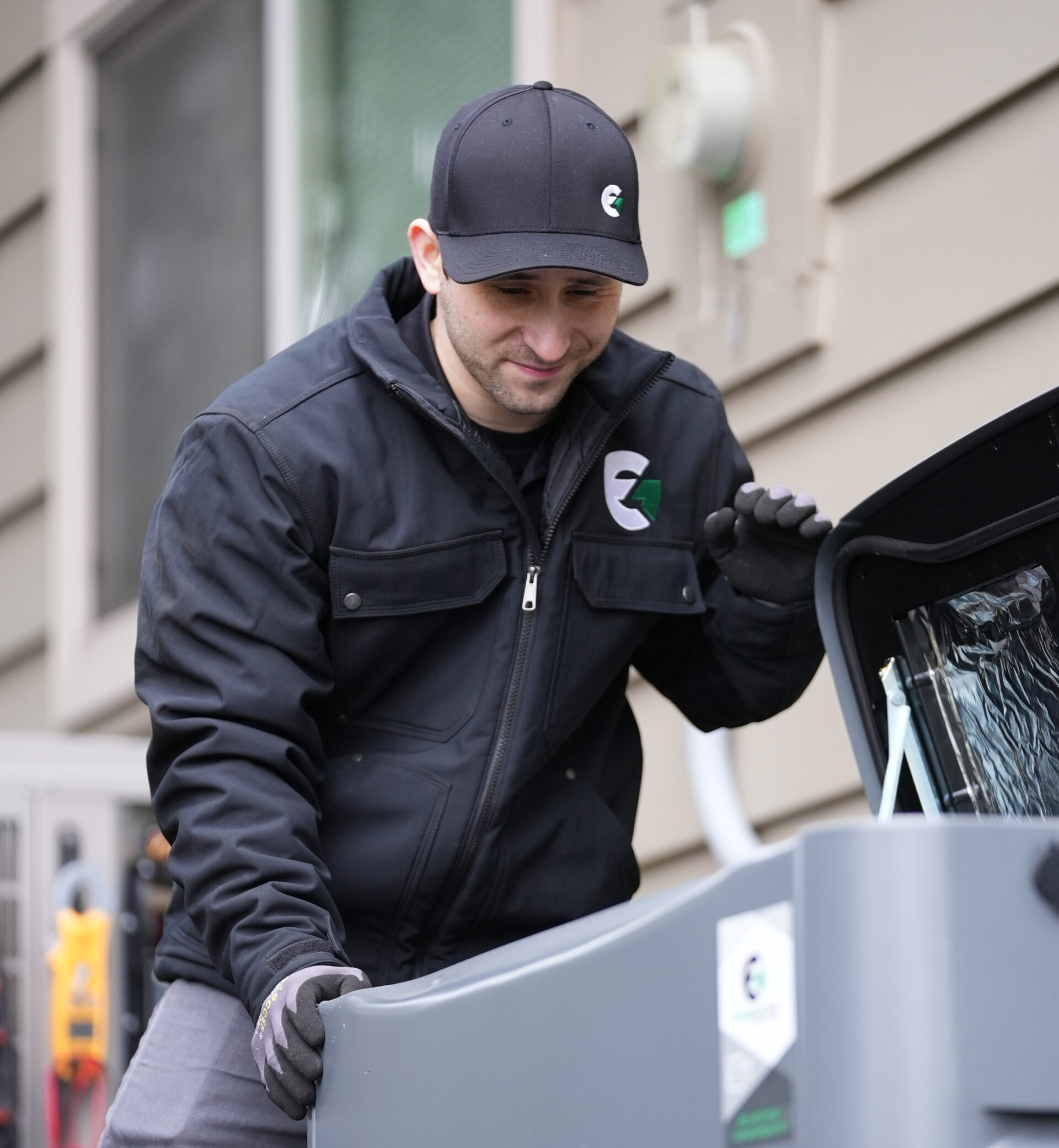 evergreen-tech An Evergreen technician working on a generator outside