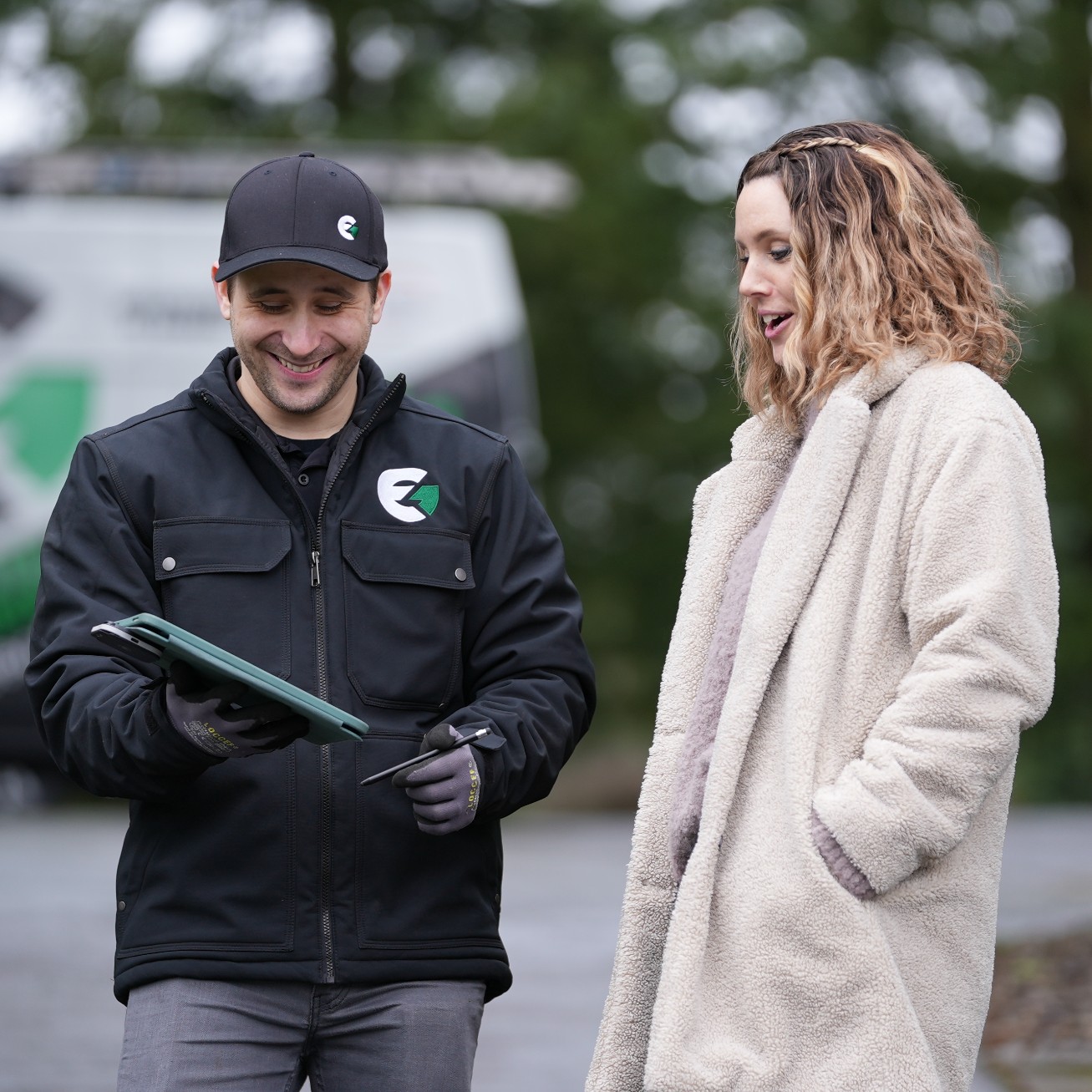 Evergreen Specialist speaking with a customer about a service.